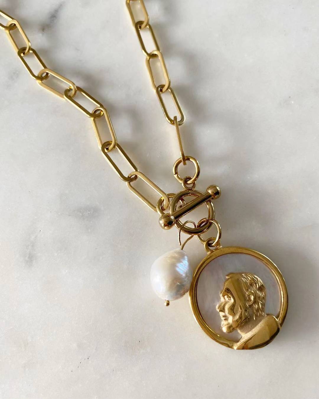 St. Pio Toggle Lock with Pearl Necklace