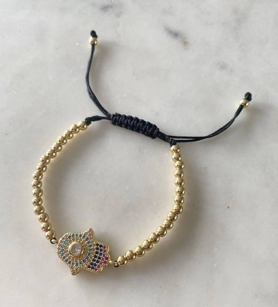 Harper gold bead with Hamsa Evil Eye Charm