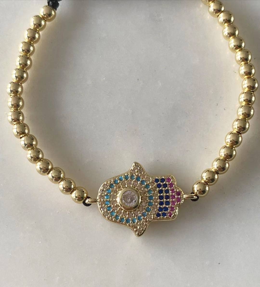Harper gold bead with Hamsa Evil Eye Charm