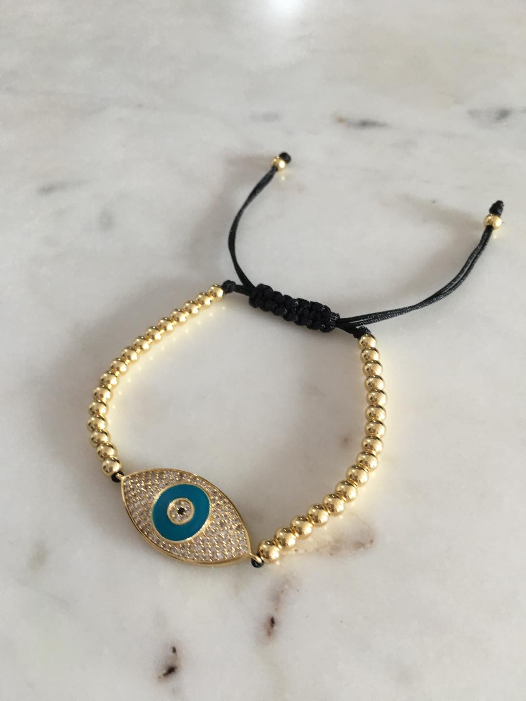 Harper gold bead evil eye charm