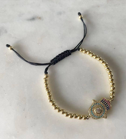 Harper gold bead with Hamsa Evil Eye Charm